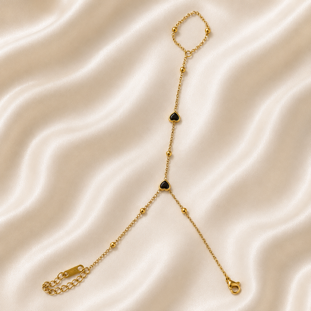 Gold Hand Chain Bracelet with Black Heart Accents and Adjustable Chain by ZenviraLuxe