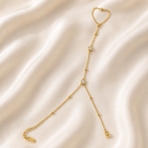 Crystal gold hand chain bracelet on satin background