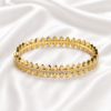 Bangals (5) ZL0450650 Gold crystal crown bangle on white satin background