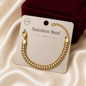 Luxury gold-tone crystal rope chain bracelet displayed on a premium stainless steel jewellery card