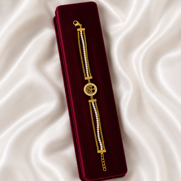 Luxury gold-tone Tree of Life crystal bracelet displayed in a premium velvet jewellery box