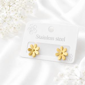 Gold daisy stainless steel ear studs on a white display card.