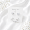 Silver stainless steel ear stud set with sparkling crystal studs and stylish initial letter earrings.