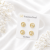Gold-tone stainless steel initial letter ear stud set with a minimalist circular design.