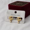 Gold-tone Double G stainless steel ear studs with crystal accents and dangling crystal charms.