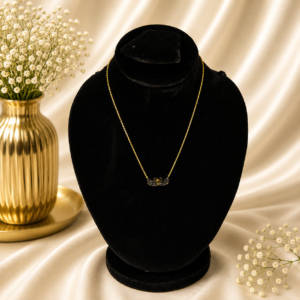 Crystal swan gold stainless steel necklace displayed on a black velvet jewelry stand.