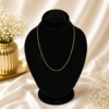 Minimal gold stainless steel box chain necklace displayed on a black velvet jewelry bust.