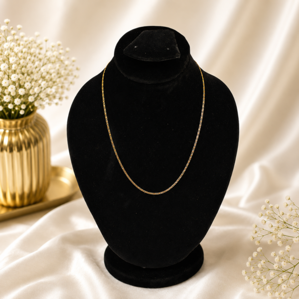 Minimal gold stainless steel box chain necklace displayed on a black velvet jewelry bust.